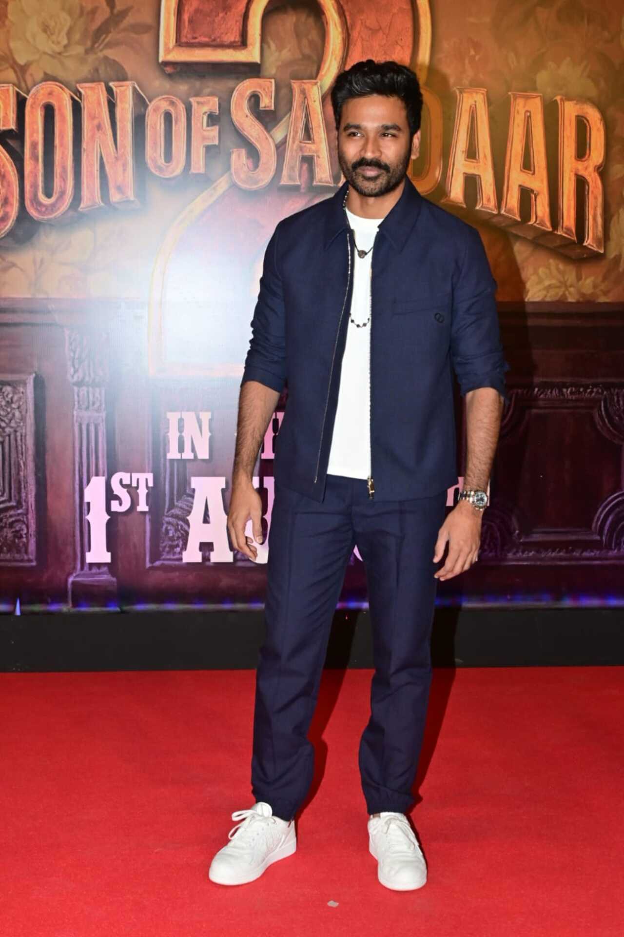 To support the cast, Tamil star Dhanush came to support the cast of the Tamil. he looked absolutely dashing in a white t-shirt and paired it with navy blue jacket and matching denims. 